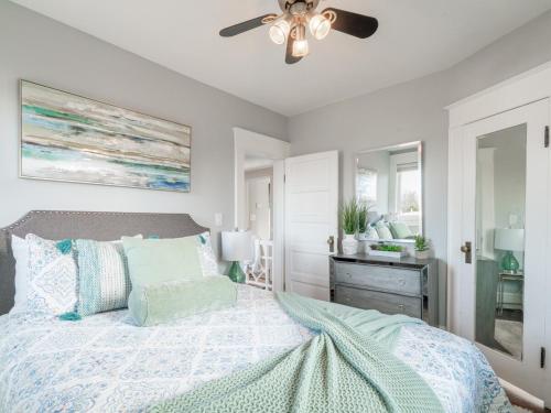 a bedroom with a bed and a ceiling fan at Historic Home with King Bed in High Point