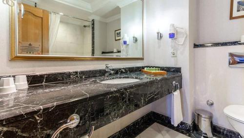 a bathroom with a sink and a mirror at The Norm Oriental Kemer in Kemer