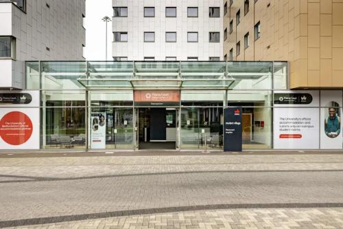 a glass entrance to a building in a city at Fitzroy Court near Luton Airport in Luton