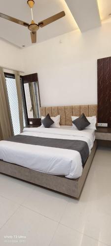 a bedroom with two beds in a room at Hotel Ramlalla in Khātu