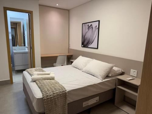 a bedroom with a large bed in a room at Apts in a Building with Pool and Gym - GRL in Anápolis