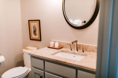 a bathroom with a sink and a mirror at BEAUTIFUL Jasper Highlands Cabin - AZALEA in Jasper