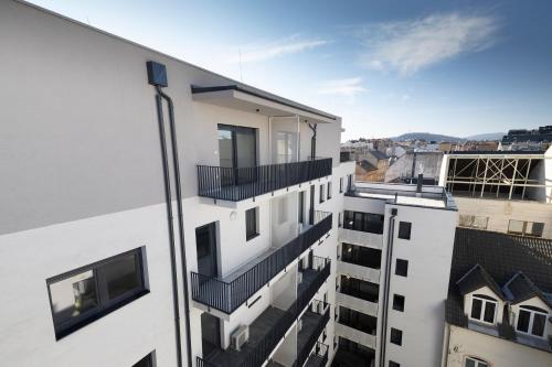 an apartment building with balconies on the side of it at Villa Oliver 2 Budapest in Budapest