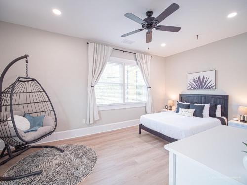 a bedroom with a swing and a bed at The Maison at Marietta Square in Marietta