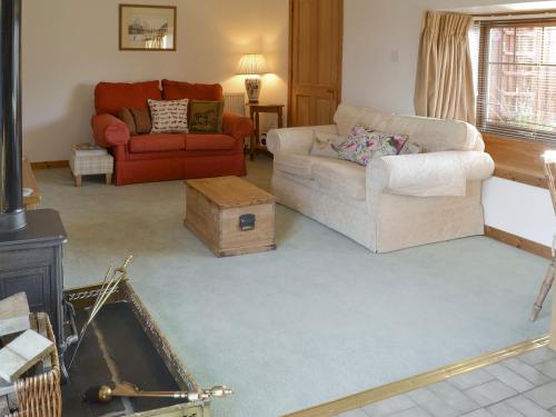 a living room with two chairs and a couch at Shedend in Kingston