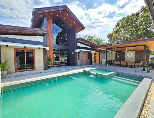 a swimming pool in the backyard of a house at Heaven staycation in Angeles