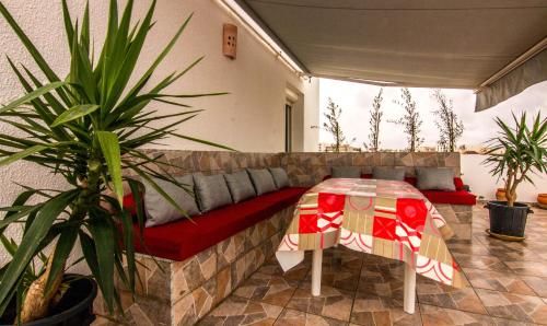 a living room with a couch and a table at Mahdia Place Apartments in Mahdia