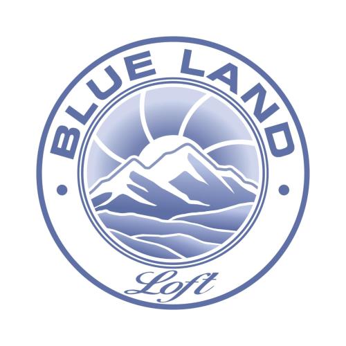 a logo for a lacrosse team with a mountain at BLUELAND Loft in Hechendorf