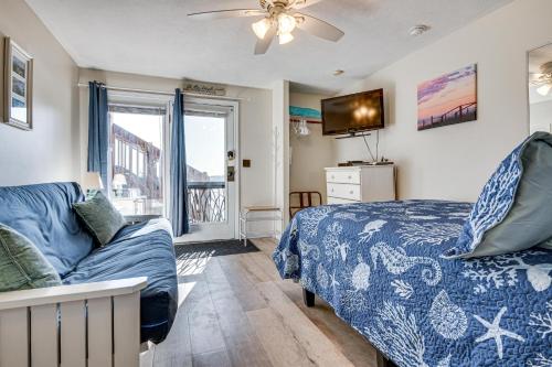 a bedroom with a bed and a couch and a tv at Steps to Sandy Beach! Oceanfront Old Orchard Gem in Old Orchard Beach
