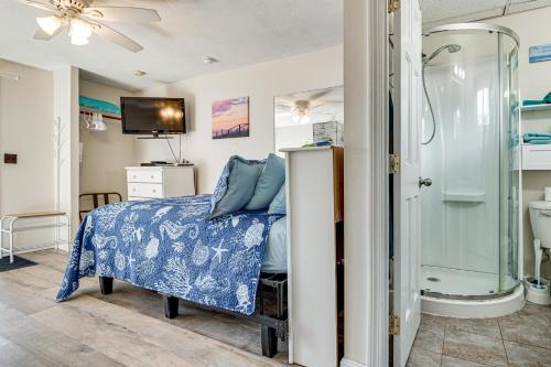 a bedroom with a bed and a shower at Steps to Sandy Beach! Oceanfront Old Orchard Gem in Old Orchard Beach