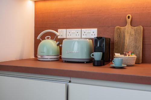 a kitchen counter with two toasters and a toaster at Cozy luxury 1-bedroom in Nicosia’s heart in Nicosia