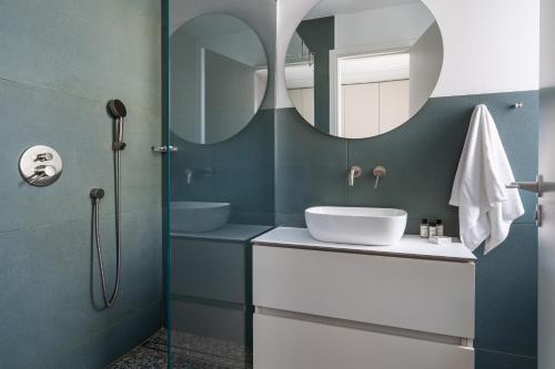 a bathroom with a sink and a mirror at Cozy luxury 1-bedroom in Nicosia’s heart in Nicosia