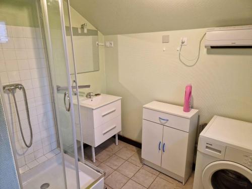 a bathroom with a shower and a toilet and a sink at La Chaussée de l'Etang in Marcenay
