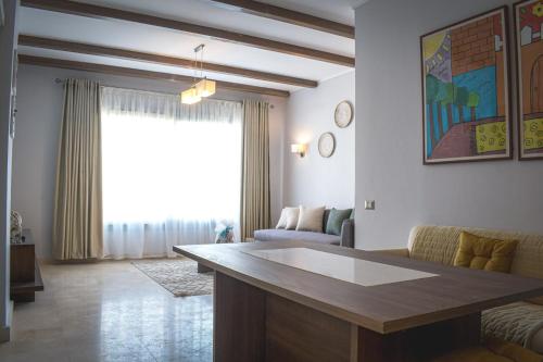 Chic Palm Hills Retreat-1BR The Village New Cairo