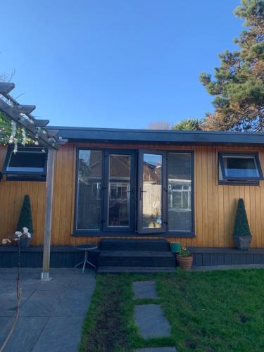 a screened in porch of a house with windows at Lindas LODGE Free PARKING air con plus provisions included in Hove