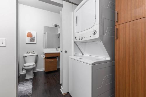 a bathroom with a sink and a toilet at The Pendleton Boutique Stylish 1 bedroom Condo in Traverse City
