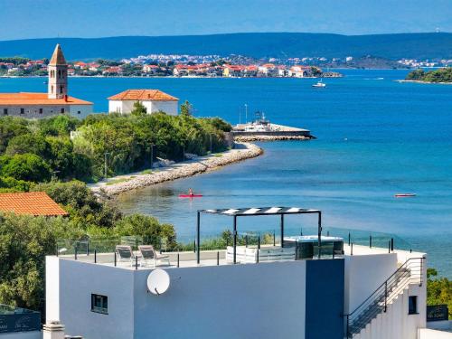 a building with a view of a body of water at Villa Magic Sky 1 by Interhome in Kraj