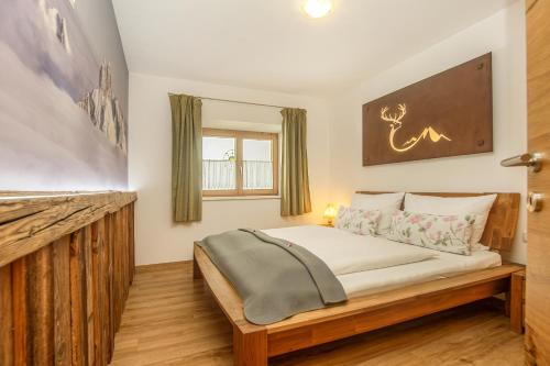 a bedroom with a bed and a fireplace at Ferienwohnung Bergblick in Filzmoos