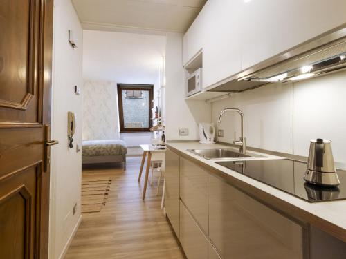 a kitchen with a sink and a counter top at Studio Studio T by Interhome in Bormio