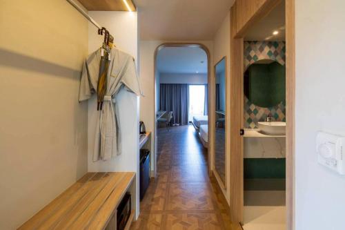 a hallway of a hotel room with a bathroom at Garden Sea View Resort in North Pattaya
