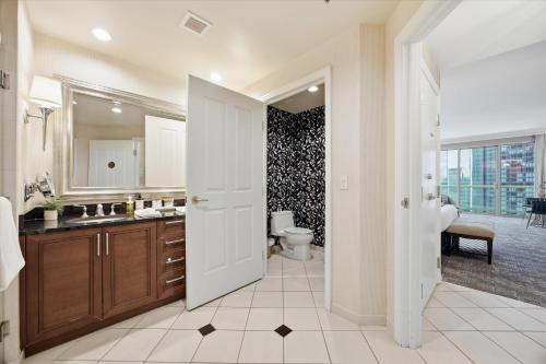 a bathroom with a toilet and a sink at Stunning Balcony Strip View MGM Signature * Free Valet in Las Vegas