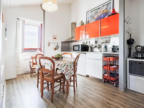 a kitchen with a table and chairs in a room at Apartment Barasteguia by Interhome in Ciboure
