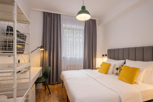 a hotel room with a bed and a desk at Pytloun Self Check-in Hotel Liberec in Liberec