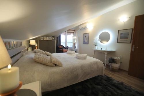 a bedroom with a large bed and a sink at Lacus Orestias - unlimited view in Kastoria