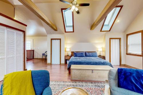 a bedroom with a bed and a ceiling fan at Chautauqua Lake Views! Bemus Point Getaway in Bemus Point