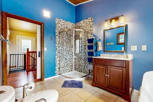 a bathroom with a shower and a toilet and a sink at Chautauqua Lake Views! Bemus Point Getaway in Bemus Point