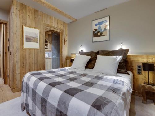 Superbe duplex 68m² avec cheminée, 2 chambres, parking intérieur, et services inclus à Val d'Isère