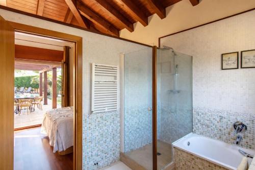 a bathroom with a shower and a bath tub at Catalunya Casas A Costa Brava gem - only a few minutes to the beach! in Vidreres