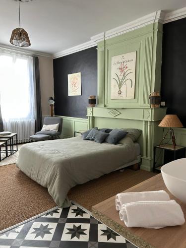 a bedroom with a large bed in a room at Casa 17 Confolens in Confolens