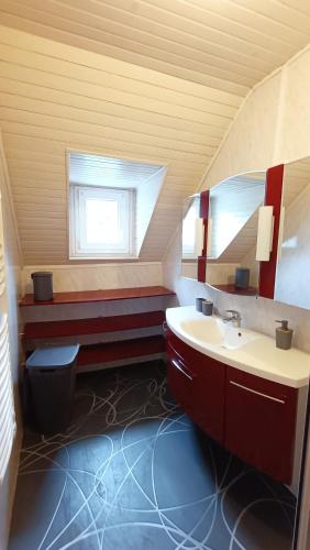 a bathroom with a sink and a window at Le Chaudron de Loguivy in Loguivy-Plougras