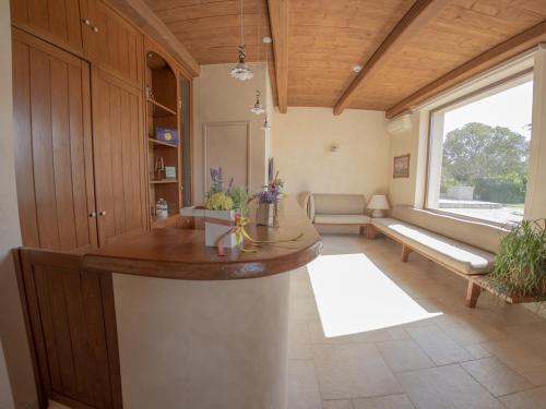 a kitchen with a island in a living room at Masseria Chinunno in Altamura