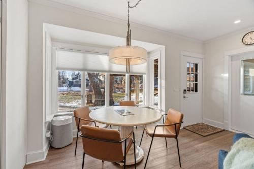 a dining room with a table and chairs at Featherstone in White Bear Lake