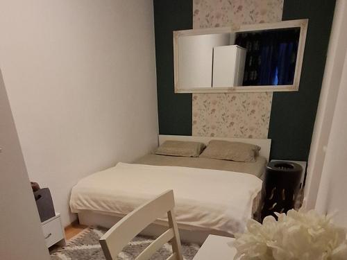a small room with two beds and a cabinet at Dani Cute in Vaslui