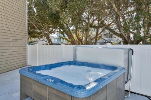 a jacuzzi tub on the back of a house at 1067 - Easy Street in Corolla