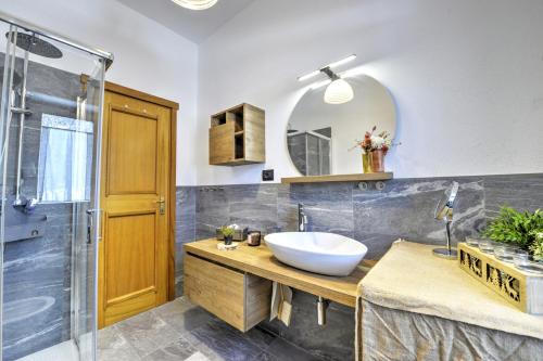 a bathroom with a sink and a shower at Anima Alpina in Morgex