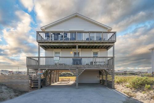 a large house with a balcony on top of it at 4785 - Paradise Found in Kitty Hawk
