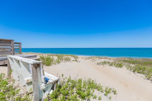 a beach with a boardwalk leading to the ocean at 5451 - Richardson in Nags Head