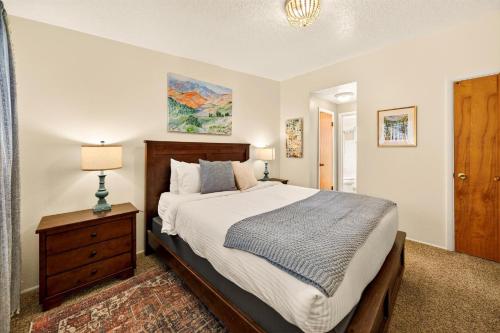 a bedroom with a bed and a dresser and a lamp at Red Ivy #5 in Boise