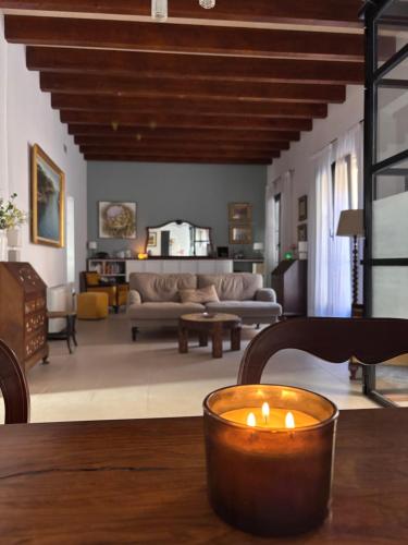 a candle sitting on a table in a living room at s'Herència in Porreres