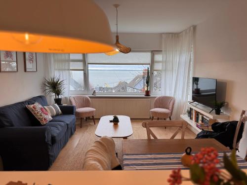 a living room with a view of the ocean at No9 Estuary Views in Southend-on-Sea