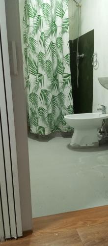 a bathroom with a sink and a mirror at Quarto no Sótão in Coruche