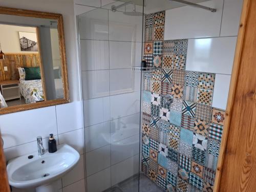 a bathroom with a sink and a shower at Fig Tree in Colesberg