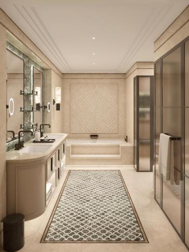a bathroom with a tub and a sink at Grand Hotel Ampezzo in Cortina dʼAmpezzo
