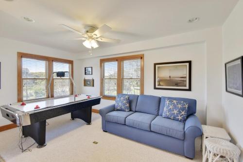 a living room with a couch and a pool table at 2437 - Sandpiper Station in Duck