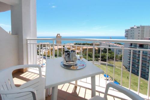 a table and chairs on a balcony with the ocean at Medplaya Hotel Bali in Benalmádena