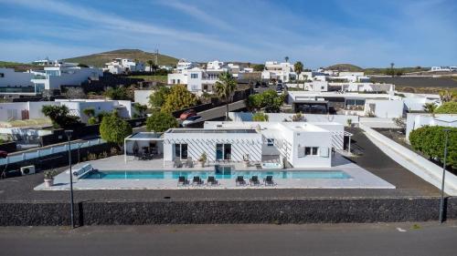 an aerial view of a house with a swimming pool at Casa Conil Private 25m Heated Pool with Hydraulic Mobility Lift in Conil